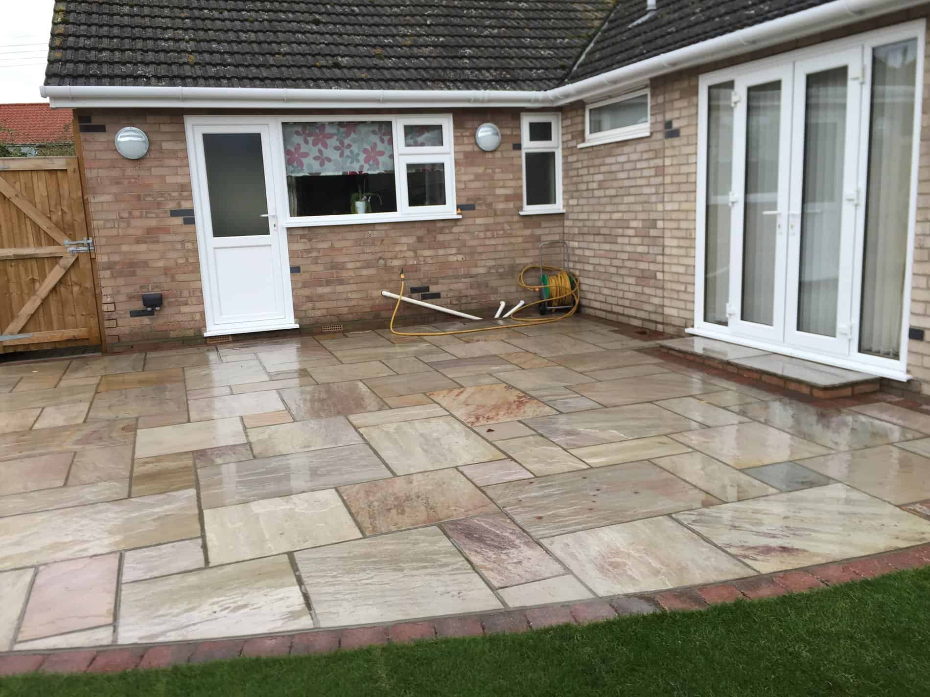 Raveena Indian sandstone patio area with burnt amber edging - Diss ...